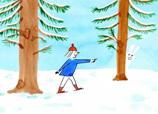 enfant qui jour à cache cache dans la neige avec un lapin